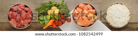 Natural ingredients for dog food in four bowls on old wooden background Royalty-Free Stock Photo #1082542499