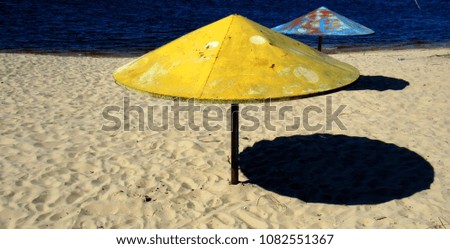 summer on a beach. old metal umbrellas with shabby paint