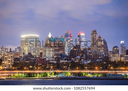 View of Manhattan skyline illuminated at dusk. New York City, USA.