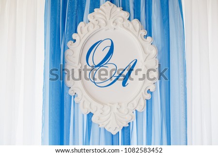 Wedding ceremony decoration in the restaurant. Decoration of wedding table with tender white textile. Elegant cafe decoration