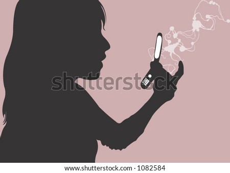 A woman reading a message on her mobile phone