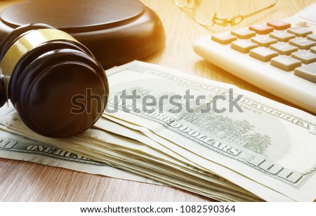 Bail bond concept. Gavel and dollar banknotes. Royalty-Free Stock Photo #1082590364