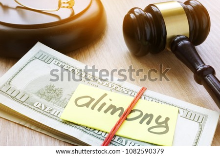 Alimony on a court desk. Divorce and separation concept Royalty-Free Stock Photo #1082590379