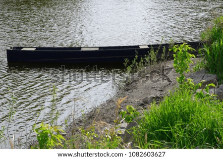 Beautiful landscape of old boat laying peacefully in the dock