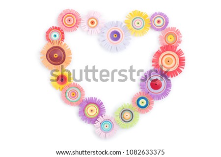 Quilling from a multi-colored heart on a white background