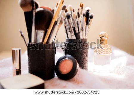 Decorative cosmetics and accessories for makeup, professional tools. Various make-up brushes, closeup photo
