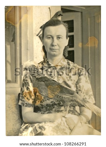 VELKY LOM, CZECHOSLOVAK REPUBLIC, CIRCA 1950 - Woman with a stuffed pheasant - circa 1950