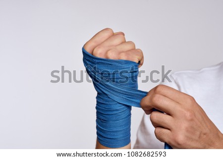 hand, blue ribbon dressing, glove                            