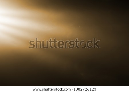 gold warm color bright lens flare rays flashes leak for transitions on black background,movie titles and overlaying Royalty-Free Stock Photo #1082726123