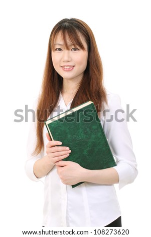 Young asian businesswoman holding a book