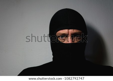 man in a police mask