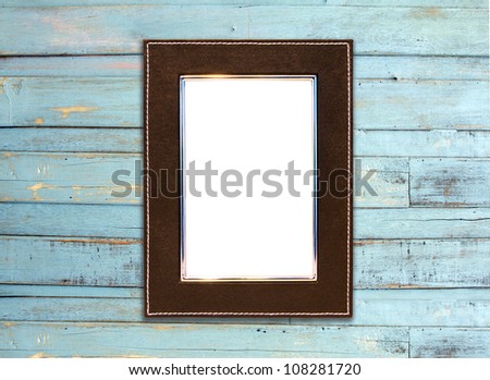Vintage picture frame, wood plated, blue wood background, clipping path included