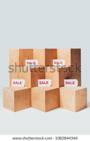 wooden stands with sale signs isolated on white, summer sale concept