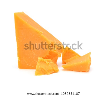 Cubes of cheddar cheese isolated on white  Royalty-Free Stock Photo #1082851187