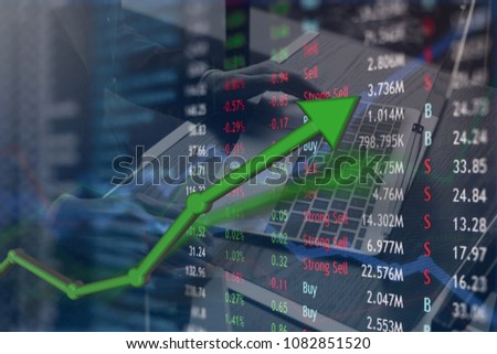 Investing and stock market concept gain and profits with faded crypto charts and bitcoin.