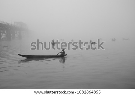 Fishermen are fishing in a winter morning at Karnafuli River in Chittagong, Bangladesh.