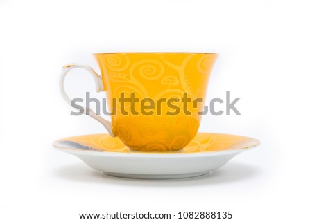 Yellow cup on white background. Isolated