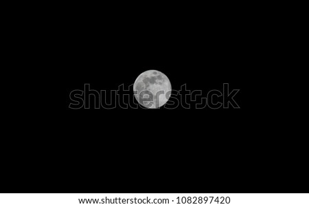 Full moon in a pitch black sky