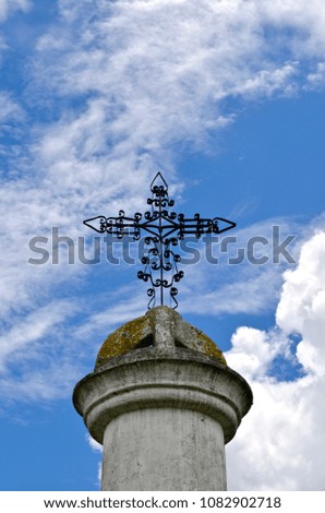 Iron Wire Cross against Blue sky with clouds, Cemetary, Salinto, Columbia, South America 