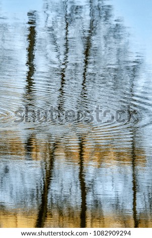 The reflection of the buildings and of the city in the water. Abstract pictures. 