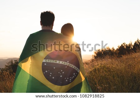couple with brazilian flag Royalty-Free Stock Photo #1082918825