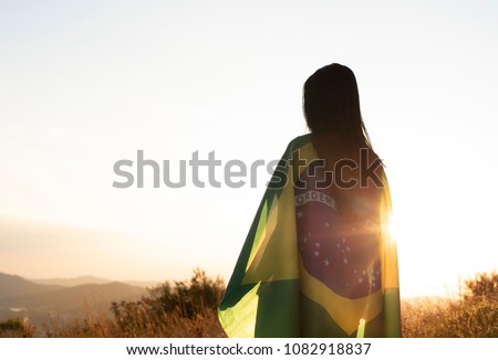woman with brazilian flag Royalty-Free Stock Photo #1082918837