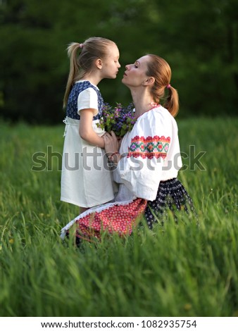 Mothers day. Happy mother with daughter. Folklore dress.