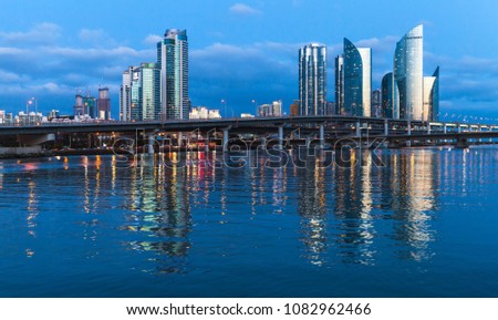 Marine City at night, panoramic skyline of luxury skyscrapers and viaducts. Expensive and prestigious residential area in Haeundae District of Busan, South Korea.  Royalty-Free Stock Photo #1082962466
