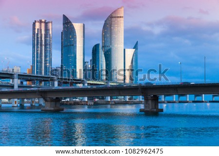 Marine City at night, expensive and prestigious residential area in Haeundae District of Busan, South Korea. Skyline of luxury skyscrapers and viaducts  Royalty-Free Stock Photo #1082962475