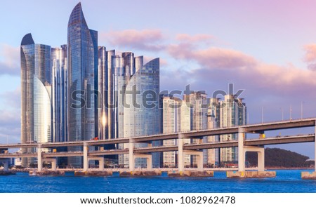 Busan, South Korea. Cityscape of Haeundae District with luxury skyscrapers and bridge in evening light Royalty-Free Stock Photo #1082962478