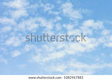 Blue sky with light white clouds. Beautiful light background.