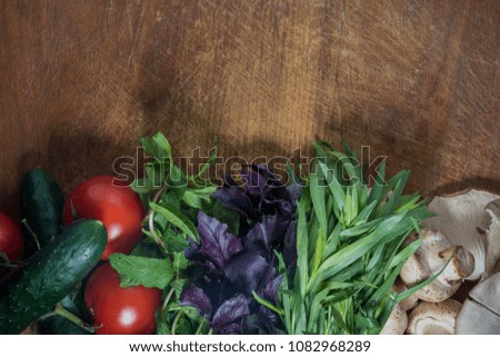 Other vegetables, cucumbers, tomatoes, greens (tarragon, mint) mushroom champignon and tree mushroom. free space for text or logo, copy paste. whit blur and sharping front and back