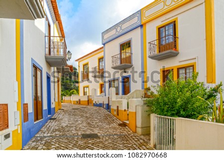 Village street with residential buildings in the town of Bordeira near Carrapateira, Municipality of Aljezur, District of Faro, Algarve Portugal Royalty-Free Stock Photo #1082970668