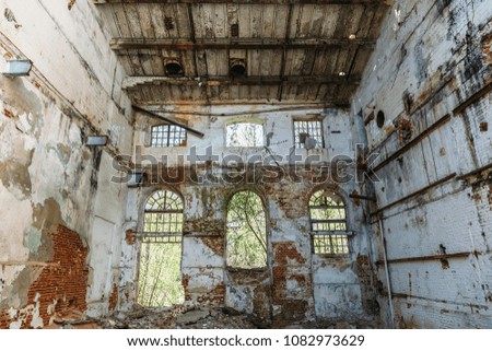 Disaster concept, inside old ruined abandoned industrial factory building, large creepy hall interior, demolition and horror atmosphere, toned