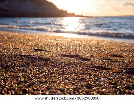 Sunset Sandy Footprints