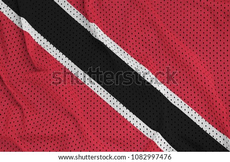 Trinidad and Tobago flag printed on a polyester nylon sportswear mesh fabric with some folds
