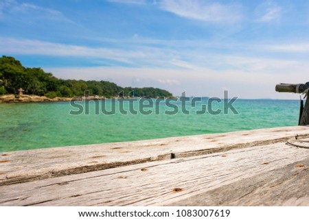 Perspective view of Old wooden bridge extending into the sea. holiday and summer scene.