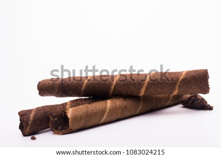 Chocolate wafer rolls stick with cream cocoa filled isolated on white background