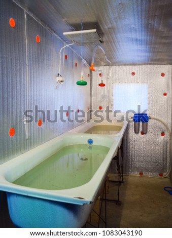 A room for growing fish fry. Bath for the fry. A fish-nursery.