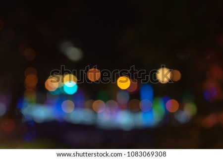 Abstract multicolor bokeh night garden in city background