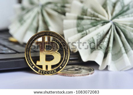 Golden bitcoin with fold radius dollar bills background