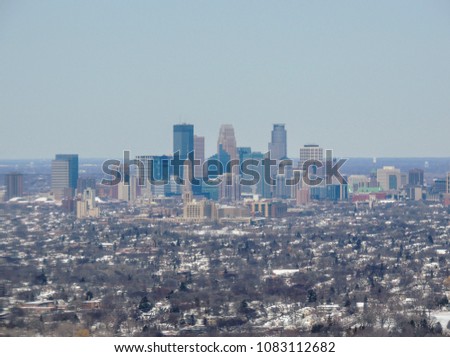 Aerial view of Minneapolis which is a major city in Minnesota in the United States, that forms "Twin Cities" with the neighboring state capital of St. Paul. Bisected by the Mississippi River, it's kno