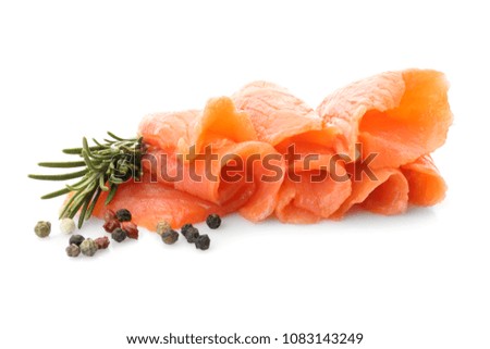 Fresh sliced salmon fillet with rosemary and pepper mix on white background