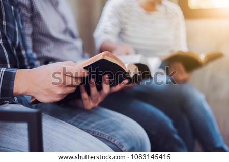Christian friends group reading and study bible together in home or Sunday school at church with window light Royalty-Free Stock Photo #1083145415