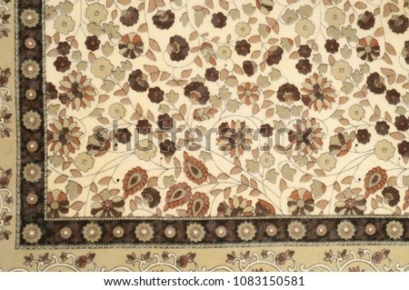 Background texture, pattern. Fabric beige with a floral pattern. Designed for free spirit. Colors include olive green, pink, yellow and fuchsia against the backdrop of ivory. Desinger dare