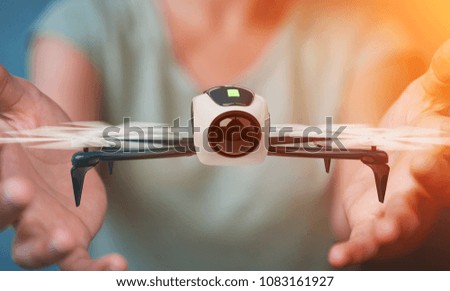 Businesswoman on blurred background using modern drone 3D rendering