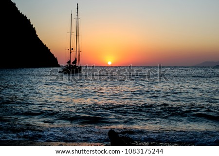 Beautiful sunset at tropical sea with long tail boat in fethiye - turkey (1)