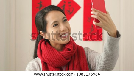 Chinese woman taking selfie in Chinese new year holiday 