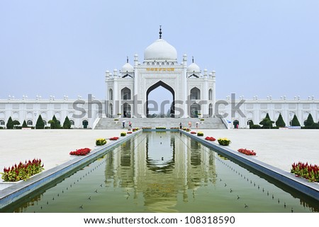 Gate with staircase of a Mosque reflected in a pond at the Hui Cultural Center in Yinchuan, Ningxia Province, China Royalty-Free Stock Photo #108318590