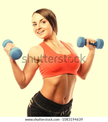 Woman in sport equipment practice with hand weights isolated on white
